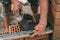 Worker or bricklayer works with trowel laying bricks. Builder makes brickwork on construction site, close up on hands