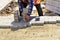 Worker brings paving slabs to lay it on the sidewalk.