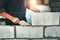 Worker building wall bricks