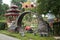 Worker builds a round entrance called a moon gate in a Chinese-style garden