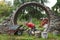 Worker builds a round entrance called a moon gate in a Chinese-style garden