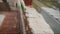 Worker builds a wall of colored brick. Worker in Close up of industrial bricklayer installing bricks and mortar cement brick on