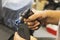 Worker burns the edges of a metal billet