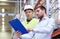 Worker and businessmen with clipboard at warehouse