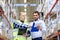 Worker and businessmen with clipboard at warehouse