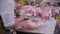 Worker Butcher at a Meat Factory Cutting Pork Meat. Fresh raw pork chops in meat factory.