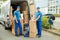 Worker With Cardboard Boxes In Front Of Truck