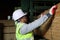 Worker carpenter measures the wood