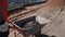 A worker carries ingredients for construction work in a wheelbarrow.