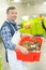 Worker carrying crate full crabs