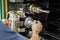 A worker changes a high-speed cutter on a CNC milling machine