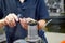 A worker changes a high speed insert on a milling cutter to work on a CNC milling machine