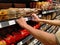 The worker is checking the price tag at the supermarket in Senayan, South Jakarta, Indonesia on March 03, 2021