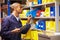 Worker Checking Stock Levels In Store Room