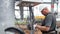 Worker checks prepared cables against transformer substation