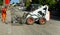 Worker checks the progress of the Milling of asphalt