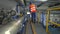 The worker checks the valves behind the compressors of the pressure biogas circuit in cogeneration plant.