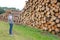 Worker choosing wood logs