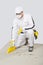 Worker clean cement base with brush-broom