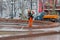 Worker cleaning a fountain with pressure washer in Novopushkinsky square in Moscow
