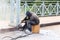 Worker cleans the metal structures sandblasting tool