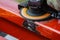 Worker cleans welding seam on steel profile