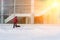 A worker clears snow after a snowstorm in front of a large office building