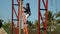 Worker climbs up steel ladder in a high rise building construction