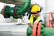 Worker closes the valve on the oil pipeline