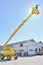 Worker on construction crane yellow