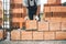 worker, construction worker using modern bricks for brickwork, building walls