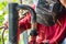 Worker cooks the heating pipe, welding joint. Preparing for winter heating