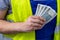 Worker counting his earnings, Polish money, Concept of wages and labor costs in industry