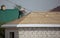 Worker covers the roof of the house