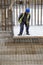 Worker with crowbar removes wooden formworks