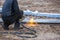 A worker cut steel beams using propane-oxygen torch.Oxy-fuel cutting