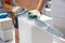 A worker cuts aerated concrete bricks with a saw