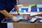 Worker cuts ceramic material with a professional tile cutter