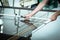 A worker cuts glass in a glass workshop