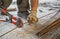 Worker cuts steel bars with bolt cutter