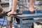 Worker cutting aluminium with grinder blade