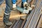 Worker cutting rebar by grinding machine