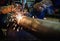 Worker cutting steel pipe with acetylene welding cutting torch a