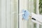 Worker disinfecting door handle
