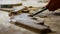 The worker dismantles the parquet floor