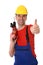 Worker with drilling machine and thumb up