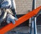 A worker drills a metal profile for the wall