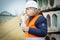 Worker drinking soda and eating french fries at construction site