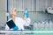 worker in drinking water factory. women workers caucasian labor in beverage clean production conveyor belt mineral water