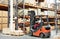 Worker driver at warehouse forklift